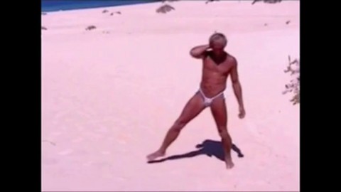 Tanned guy on beach in tiny string thong (temporarily!)