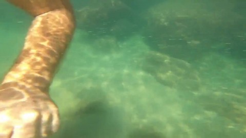 Public masturbation of a beautiful amateur couple on a public beach under the water sea